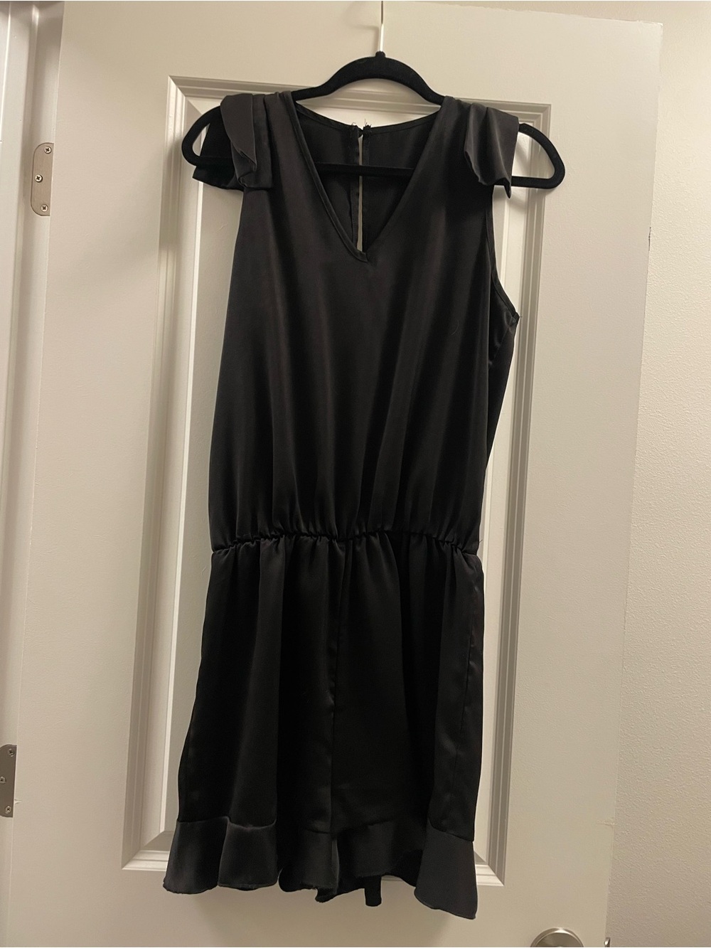 Black Sleeveless Ruffle-Hem Romper
